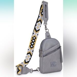 Grey sling bag with guitar strap